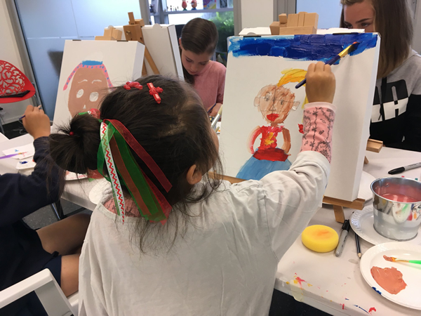 Kids painting in classroom